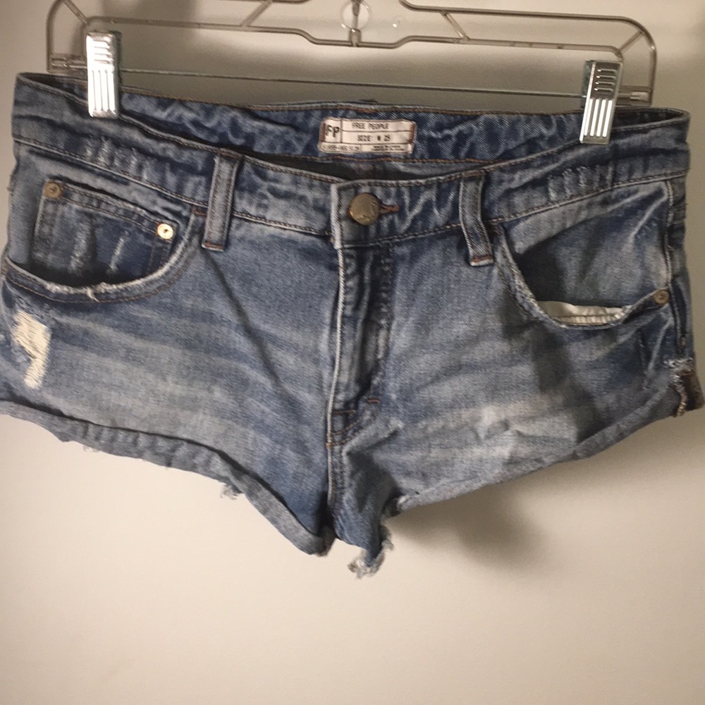 Light washed with slight rips near pocket